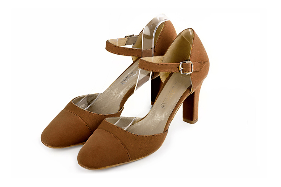 Women's caramel brown open side dress shoes, with an instep strap. Round toe. High kitten heels - Front view